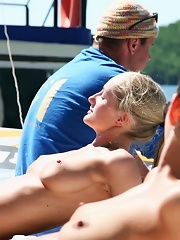 Sexy naked teens play together at a public beach